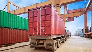 Cargo container for overseas shipping in shipyard with heavy machine . Logistics supply chain management and international goods export